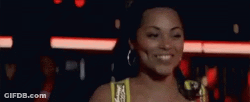 Woman In Yellow Top Smiling GIF