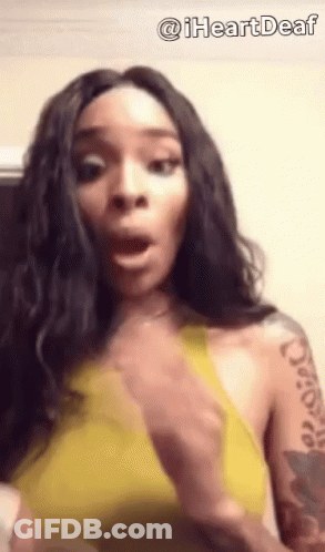 Woman In Yellow Top With Arm Tattoo GIF