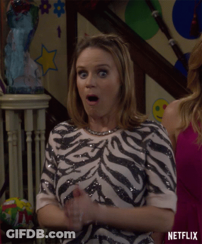 Woman In Zebra Top In Front Of Netflix GIF
