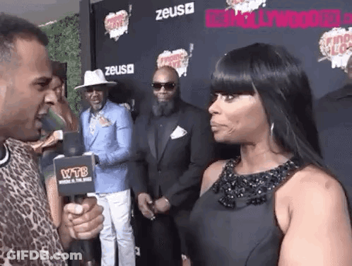 Woman Interviewed By Man With Microphone GIF