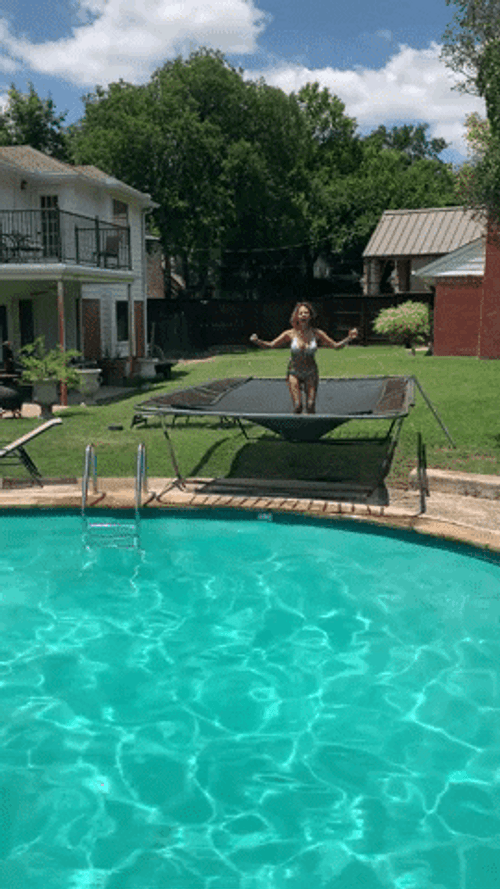 Woman Jumping On Trampoline Outside GIF