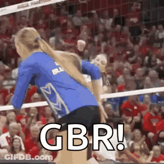 Woman Jumping Over Volleyball Net While Another Holds Her Hair GIF