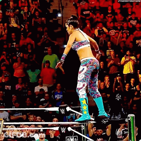 Woman Jumping Over Wrestling Ring GIF