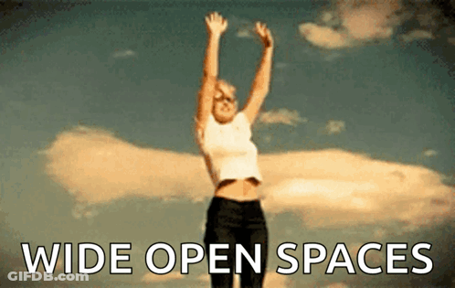 Woman Jumping With Wide Open Spaces GIF
