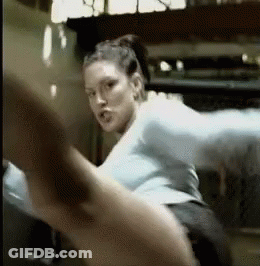 Woman Kicking Leg In Gym GIF