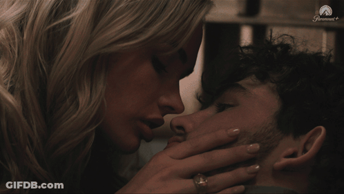 Woman Kissing Man On Cheek GIF