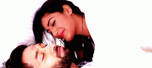 Woman Kissing Man On Forehead In Bed GIF