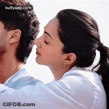 Woman Kissing Man On Nose GIF