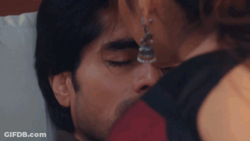 Woman Kissing Man's Face GIF