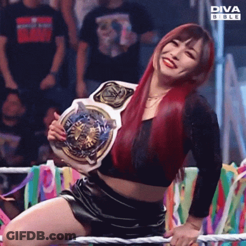 Woman Kneeling In Ring Holding Diva Bible Belt GIF