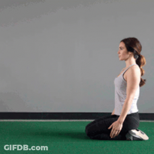 Woman Kneeling On Green Mat GIF