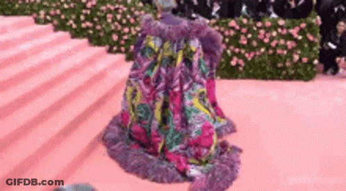 Woman Kneeling On Pink Carpet GIF