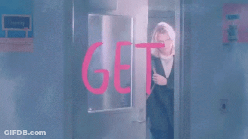 Woman Kneeling With Dog In Bag GIF