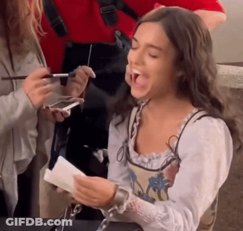 Woman Laughing And Holding Paper GIF