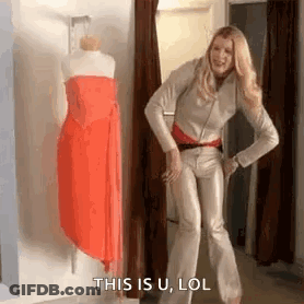 Woman Laughing At Mannequin In Dressing Room GIF