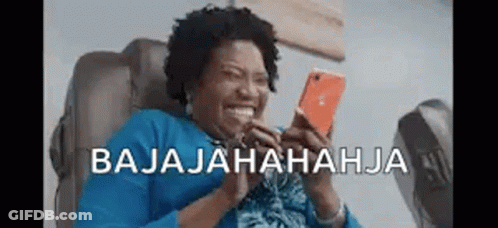 Woman Laughing At Phone In Chair GIF