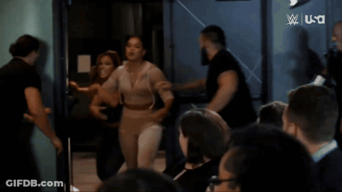 Woman Laughing Before Screen Saying Next Women's North American Championship Ladder Match GIF