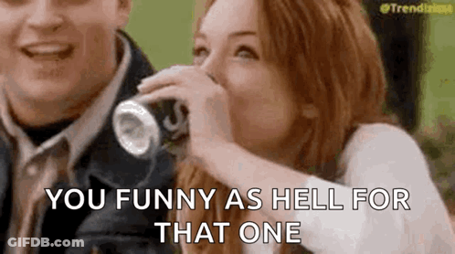 Woman Laughing Drinking From Can Man Laughing Behind GIF