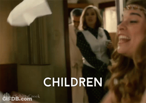 Woman Laughing Holding Children Sign GIF