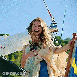 Woman Laughing Holding Flag GIF