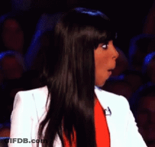 Woman Laughing In Chair With NBC Logo GIF