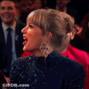 Woman Laughing In Front Of Crowd GIF