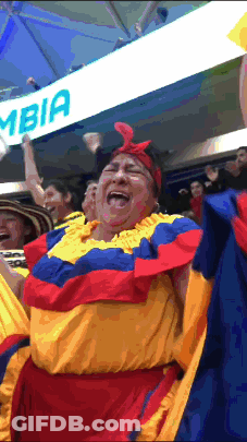 Woman Laughing In Front Of Sign Saying Ombia GIF
