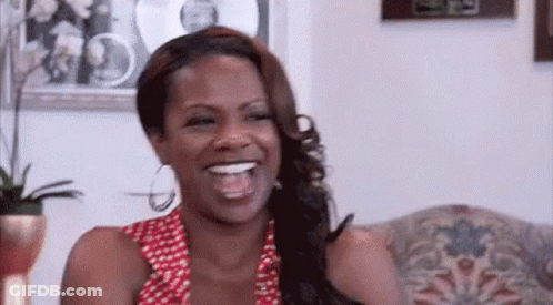 Woman Laughing On Couch GIF