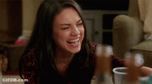 Woman Laughing Sitting At Table GIF