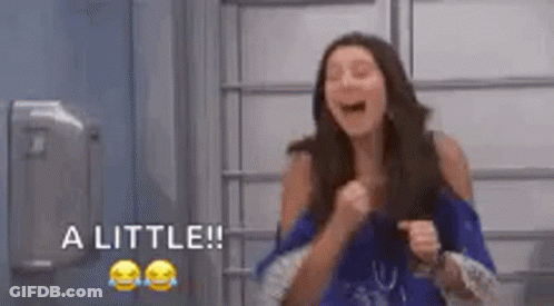 Woman Laughing With Fist In Air Saying A Little GIF