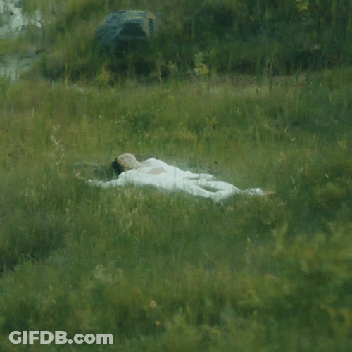 Woman Laydown In The Grass GIF