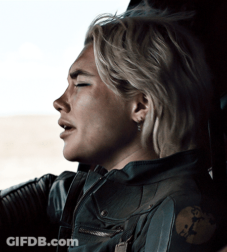 Woman Laying Down With Rifle GIF