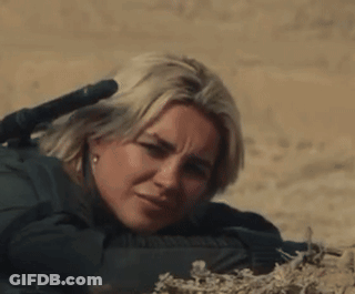 Woman Laying Down With Rifle GIF
