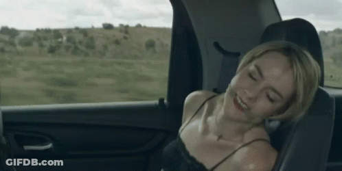 Woman Laying In Back Seat Of Car With Eyes Closed GIF