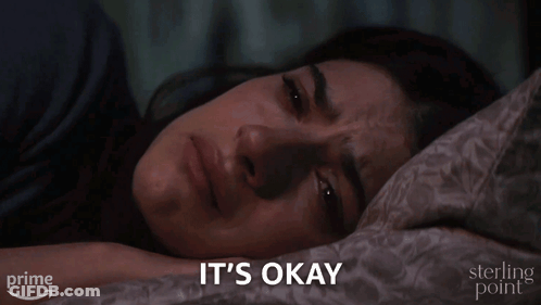 Woman Laying In Bed Saying It's Okay GIF