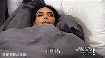 Woman Laying In Bed Under Blanket Saying This GIF