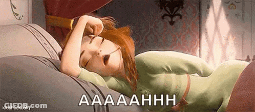 Woman Laying In Bed With Mouth Open GIF