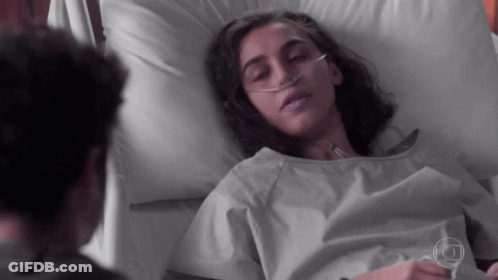 Woman Laying In Hospital Bed With Oxygen Tube GIF