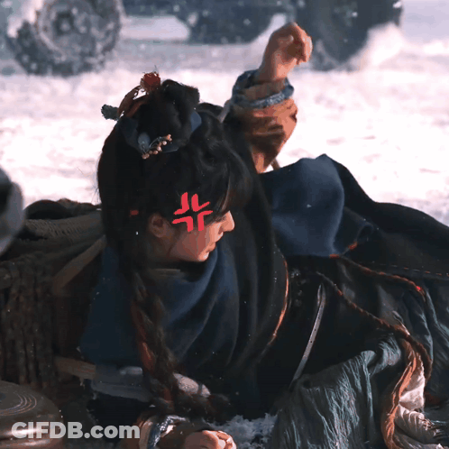 Woman Laying In Snow With Red Symbol On Forehead GIF