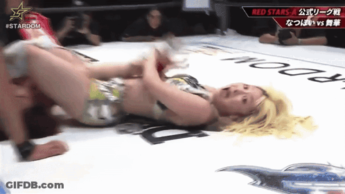 Woman Laying In Wrestling Ring With Stardom Logo GIF
