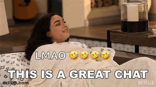 Woman Laying On Bed Saying This Is A Great Chat GIF