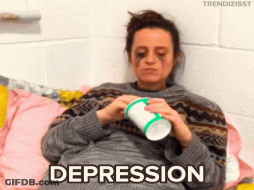 Woman Laying On Bed With Cup Saying Depression GIF