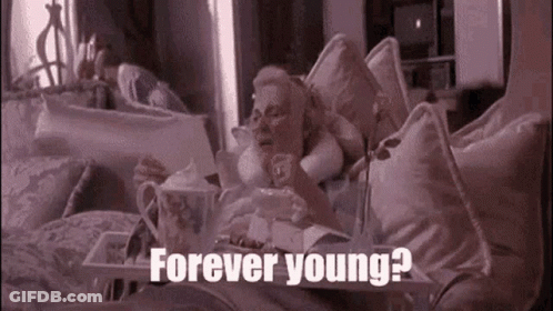 Woman Laying On Bed With Food Tray Forever Young GIF