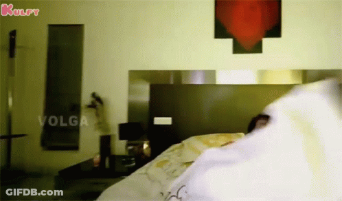 Woman Laying On Bed With Kulfy Sign GIF