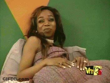Woman Laying On Bed With Sign VH1 GIF
