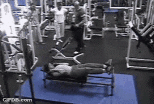 Woman Laying On Bench In Gym GIF