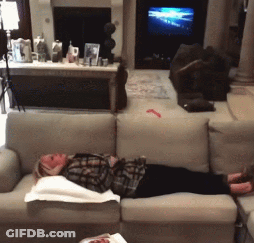 Woman Laying On Couch In Living Room GIF