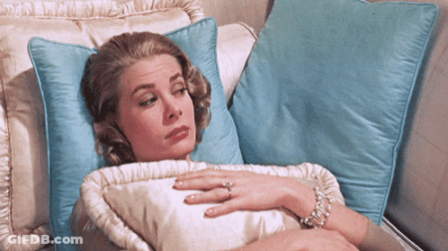Woman Laying On Couch With Blue Pillow GIF