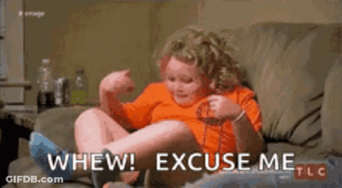 Woman Laying On Couch With Dog GIF