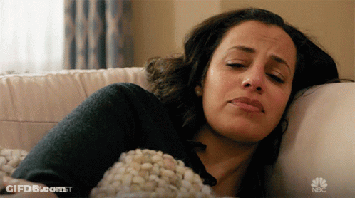 Woman Laying On Couch With NBC Logo GIF